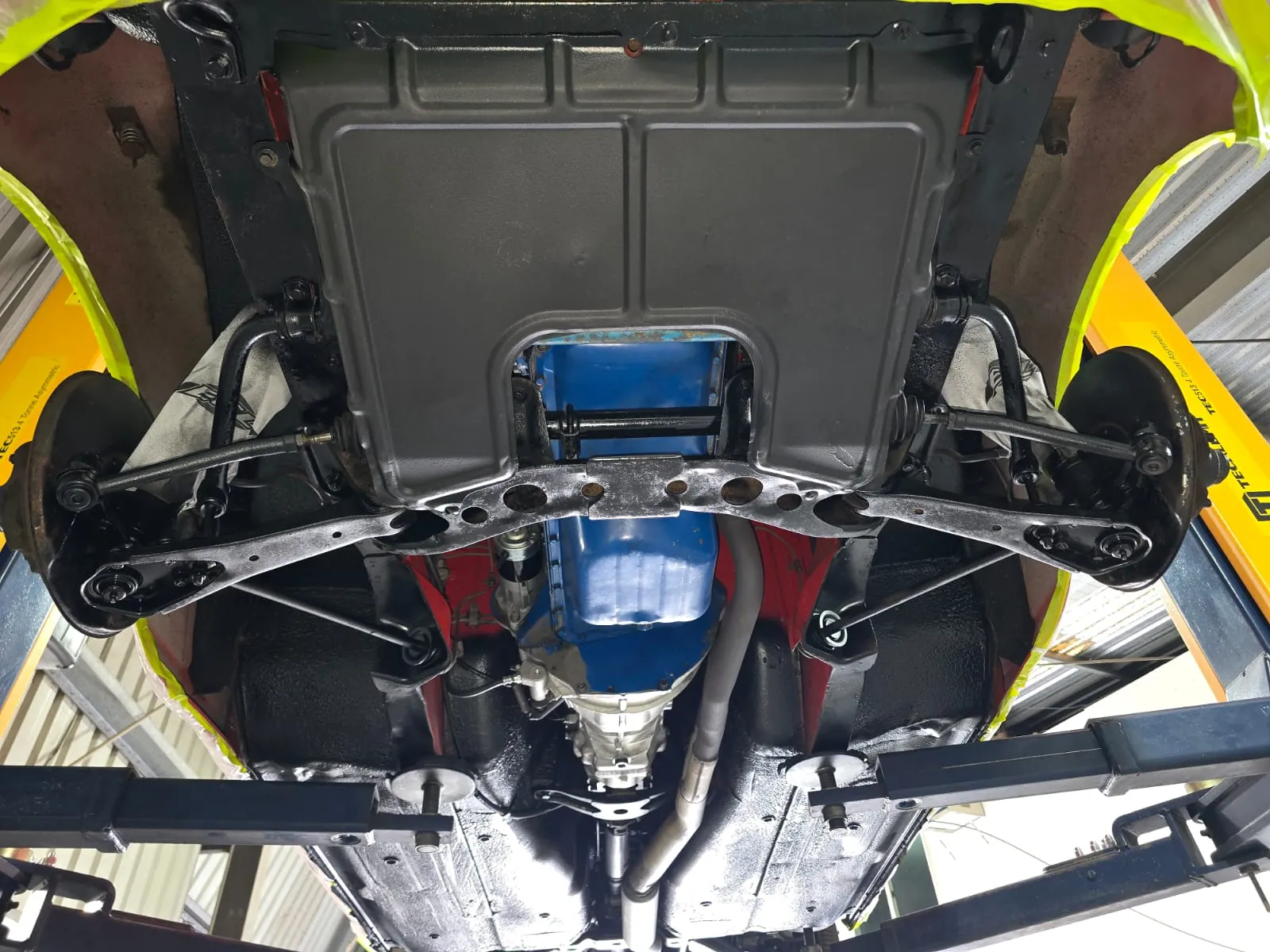 The same Nissan 240Z front underbody, crossmember and suspension after dry ice blasting and protective sealing
