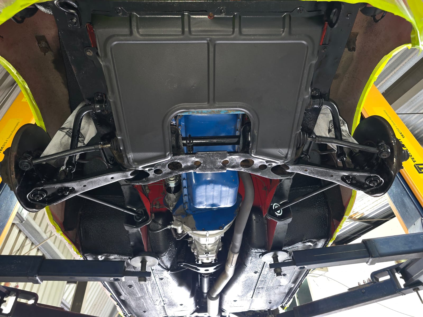 The same Nissan 240Z front underbody, crossmember and suspension after dry ice blasting and protective sealing