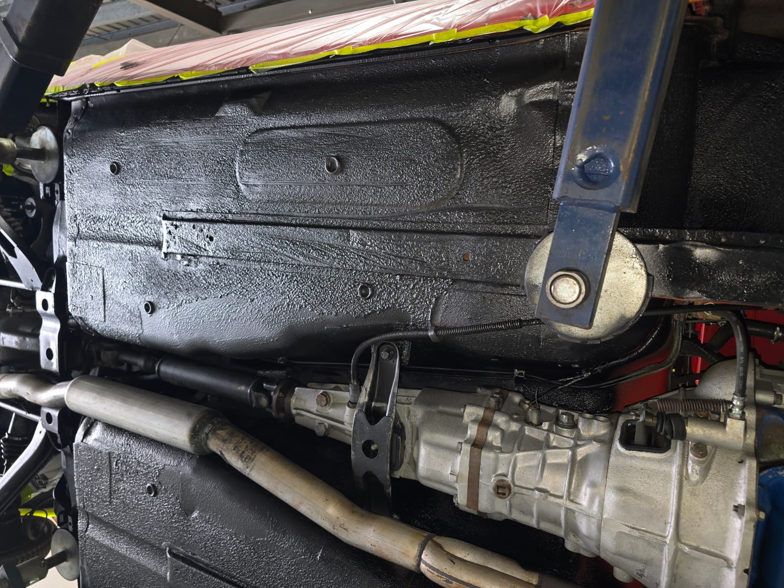 Nissan 240Z floorpan and transmission tunnel area after dry ice blasting and protective sealing